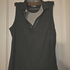 Ladies Greg Norman Golf collared, sleeveless polo shirt. Black/gray sz large